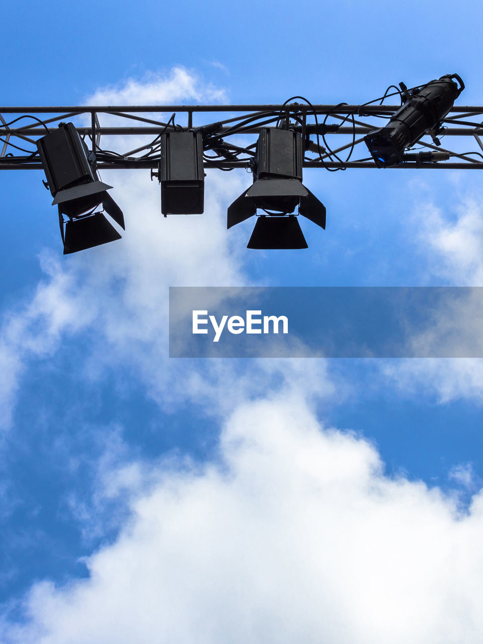 LOW ANGLE VIEW OF BLUE SKY HANGING AGAINST SILHOUETTE METAL STRUCTURE