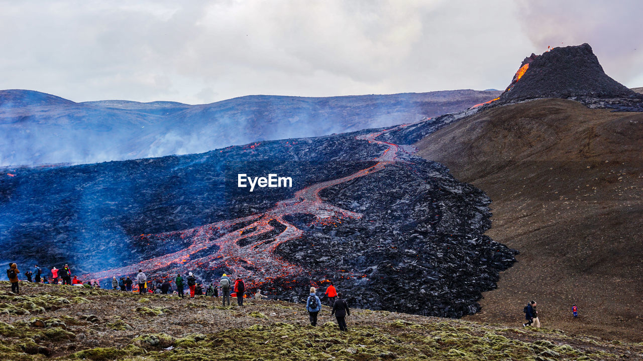 High angle view of people looking at volcanic landscape