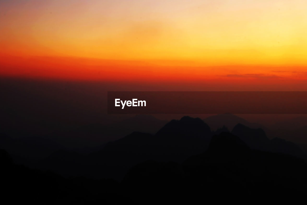 Scenic view of mountains at sunset