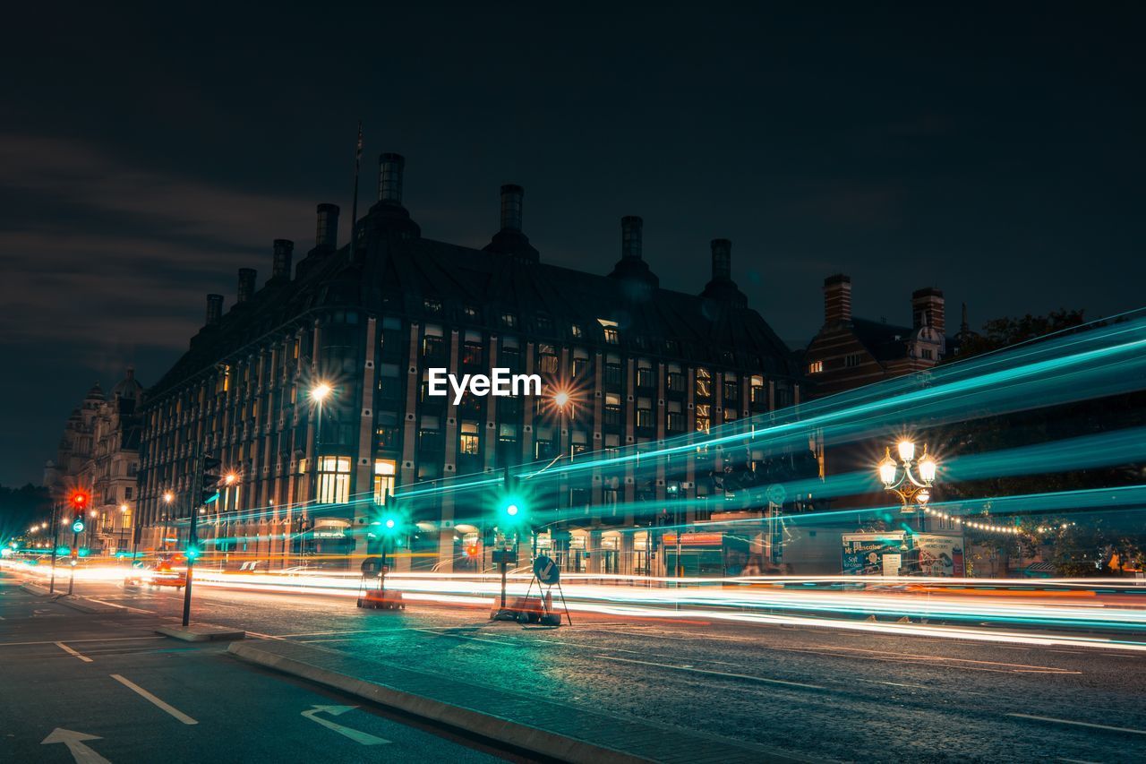 Light trails on road in city at night