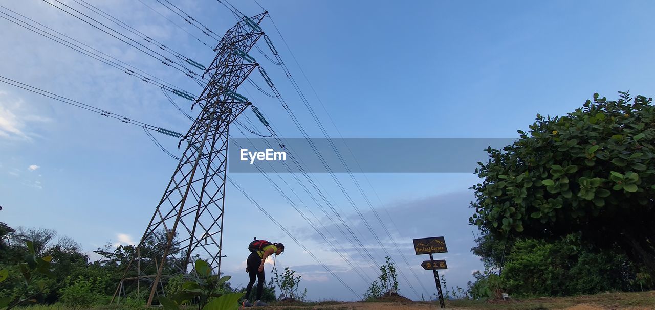 LOW ANGLE VIEW OF POWER LINES AGAINST SKY