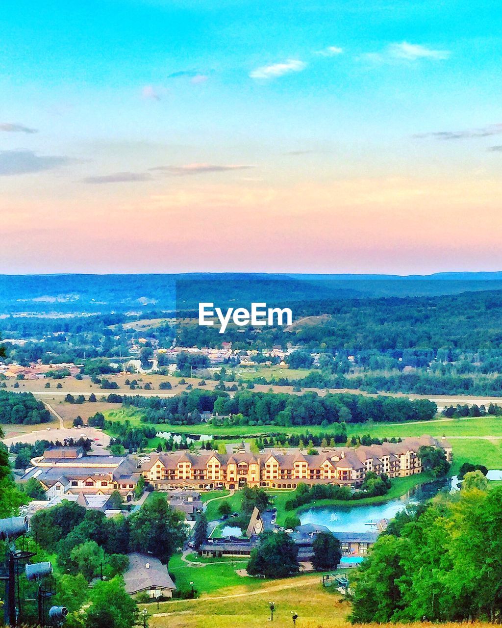 HIGH ANGLE VIEW OF CITYSCAPE AT SUNSET