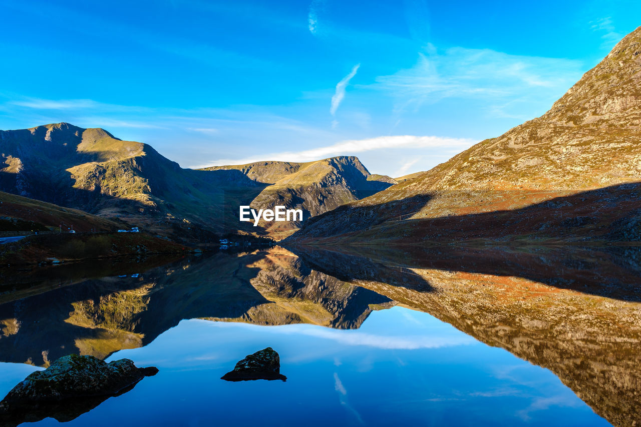 Reflections of mountains in clear lakes in snowdonia national park, north wales, uk