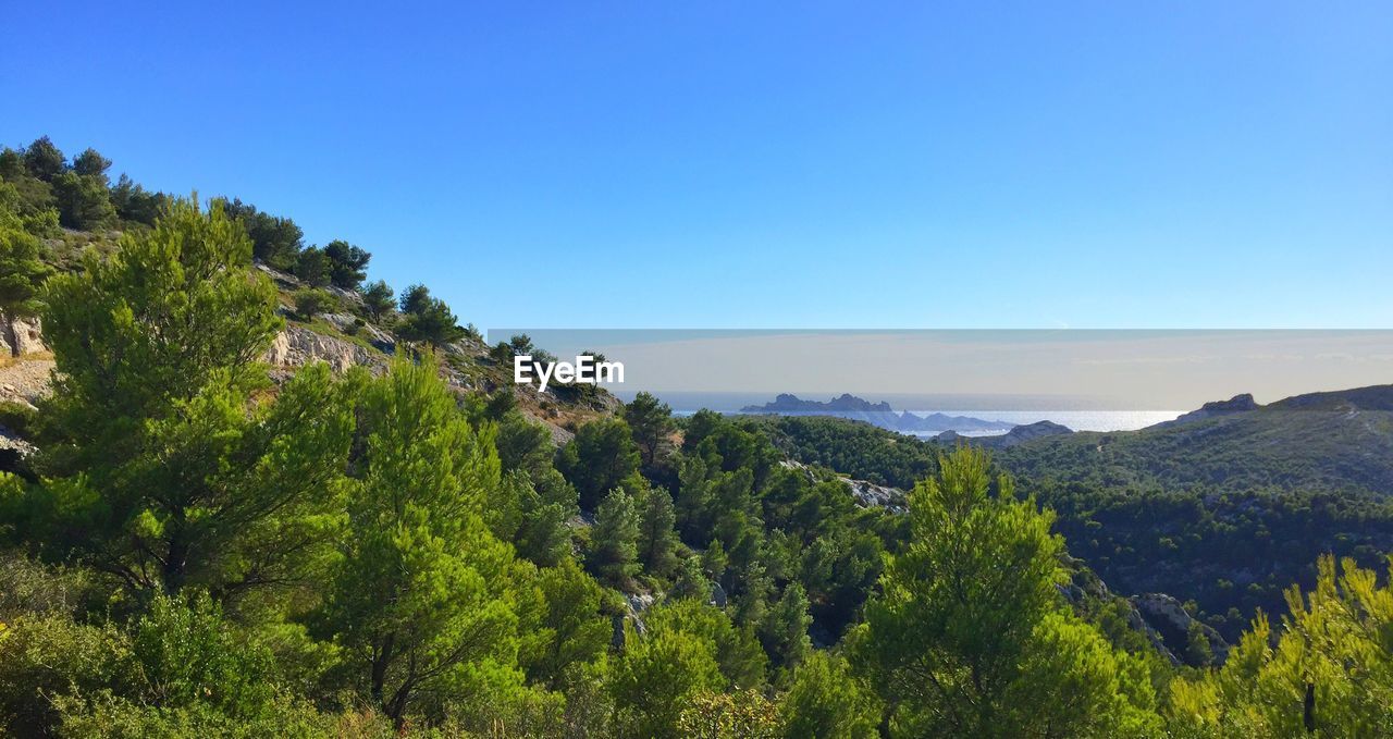 SCENIC VIEW OF MOUNTAINS AGAINST CLEAR BLUE SKY