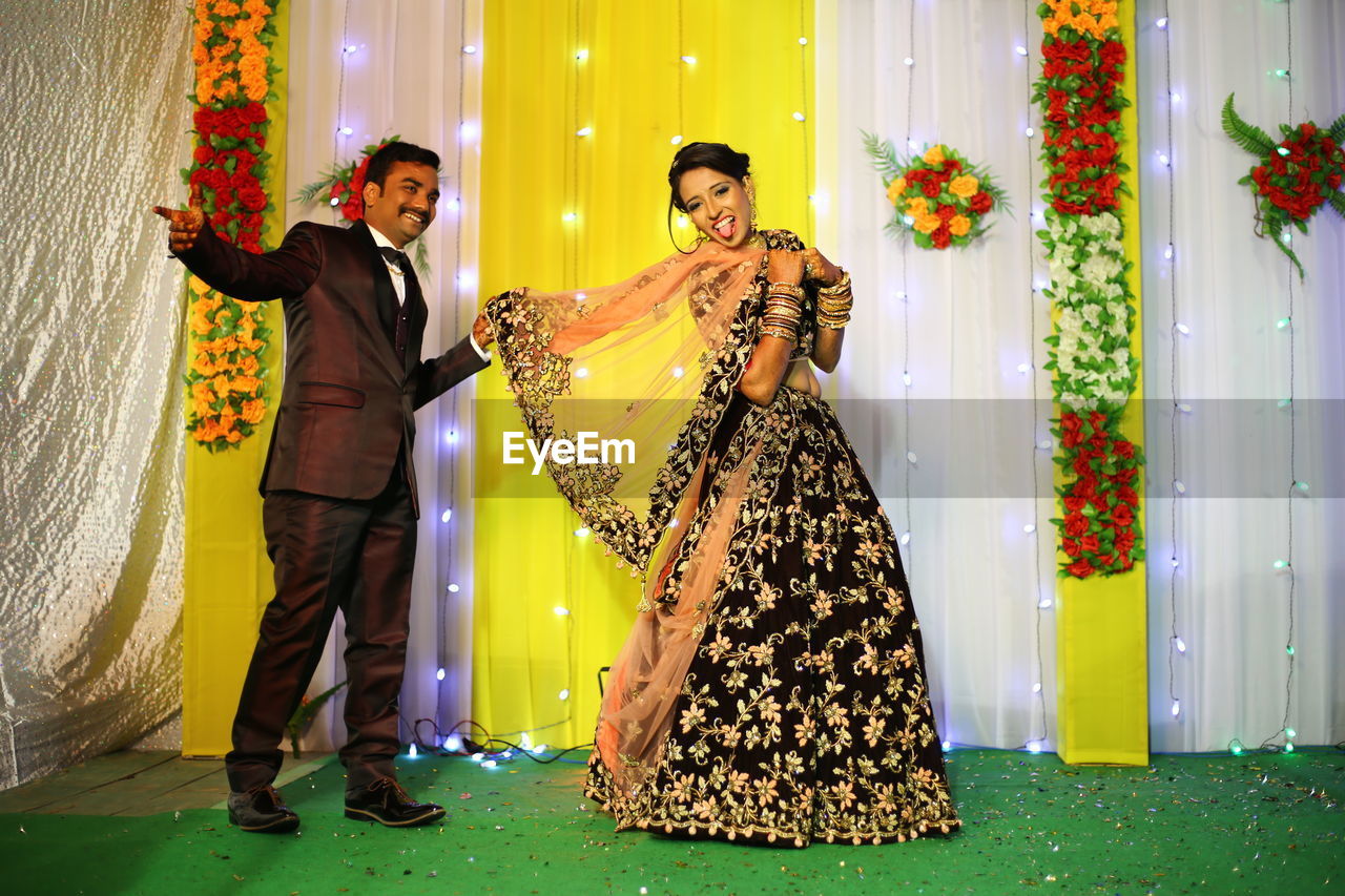 Portrait of cheerful couple at wedding