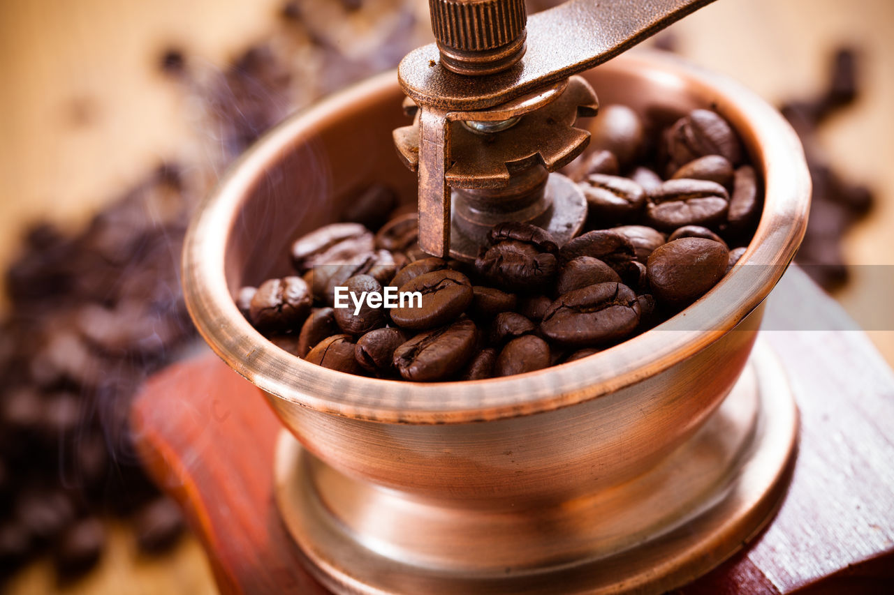 HIGH ANGLE VIEW OF COFFEE BEANS IN GLASS