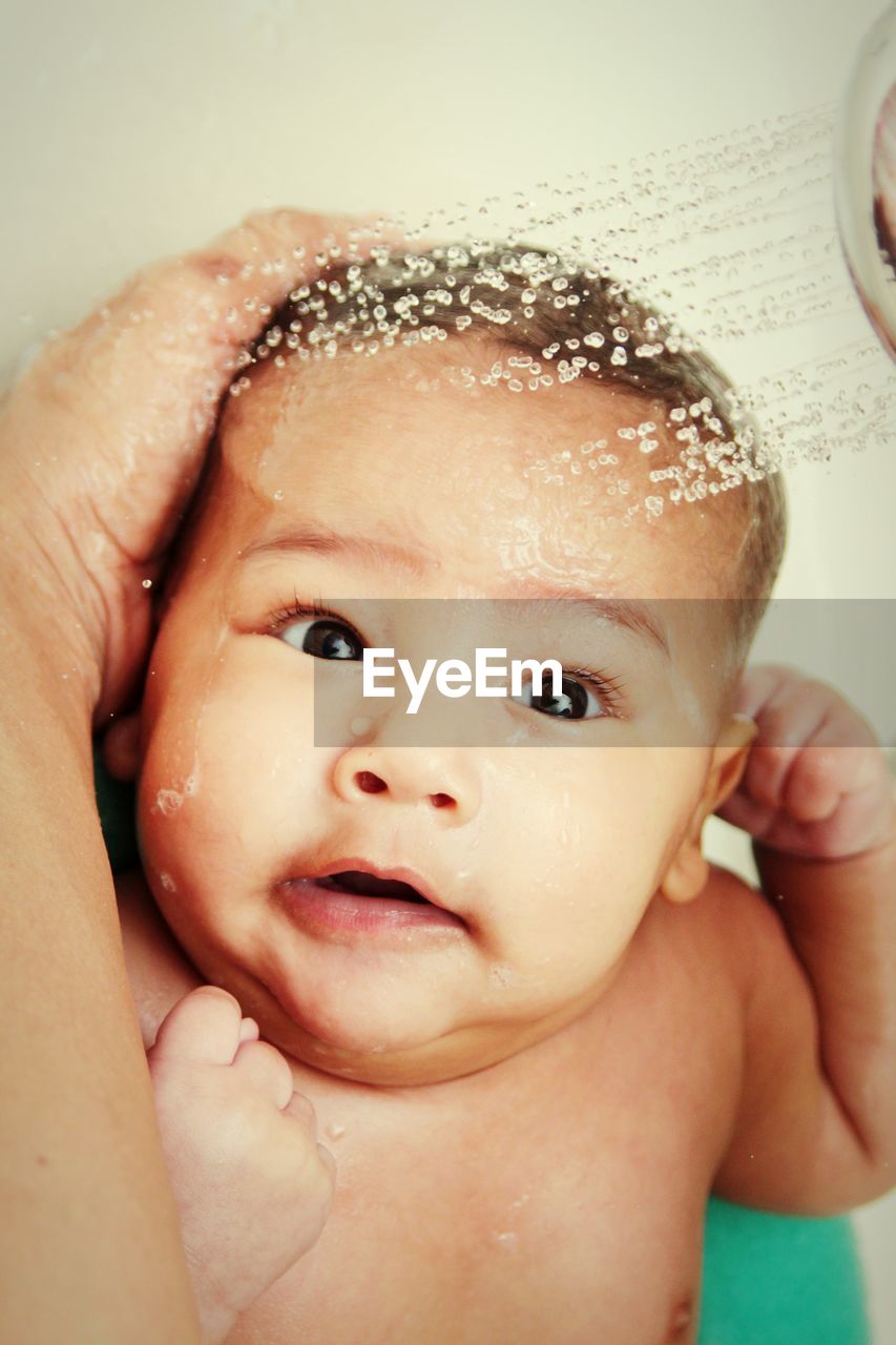 Portrait of baby boy in bathroom