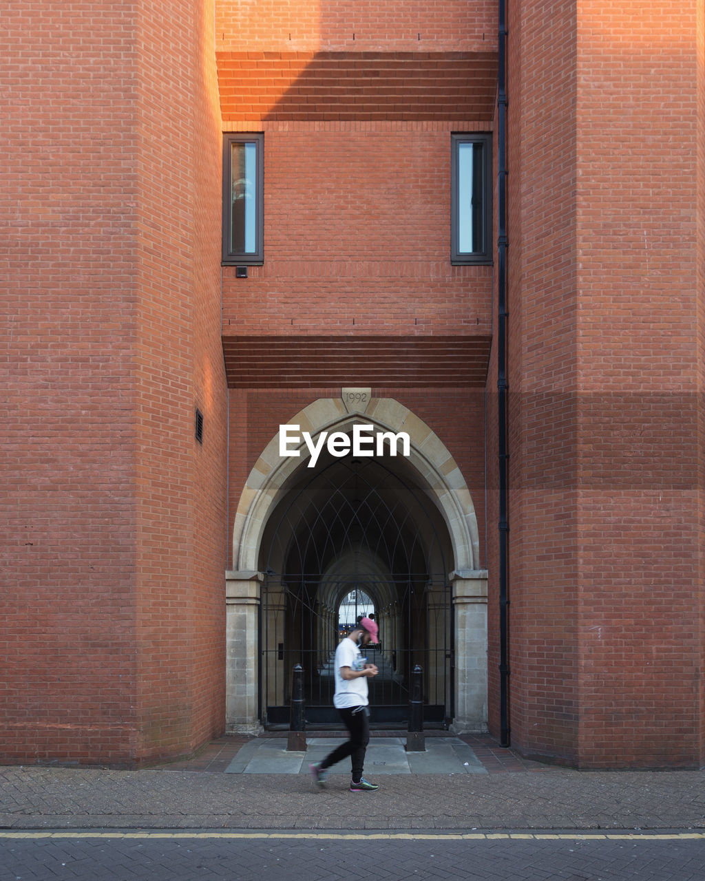 WOMAN WALKING ON BUILDING