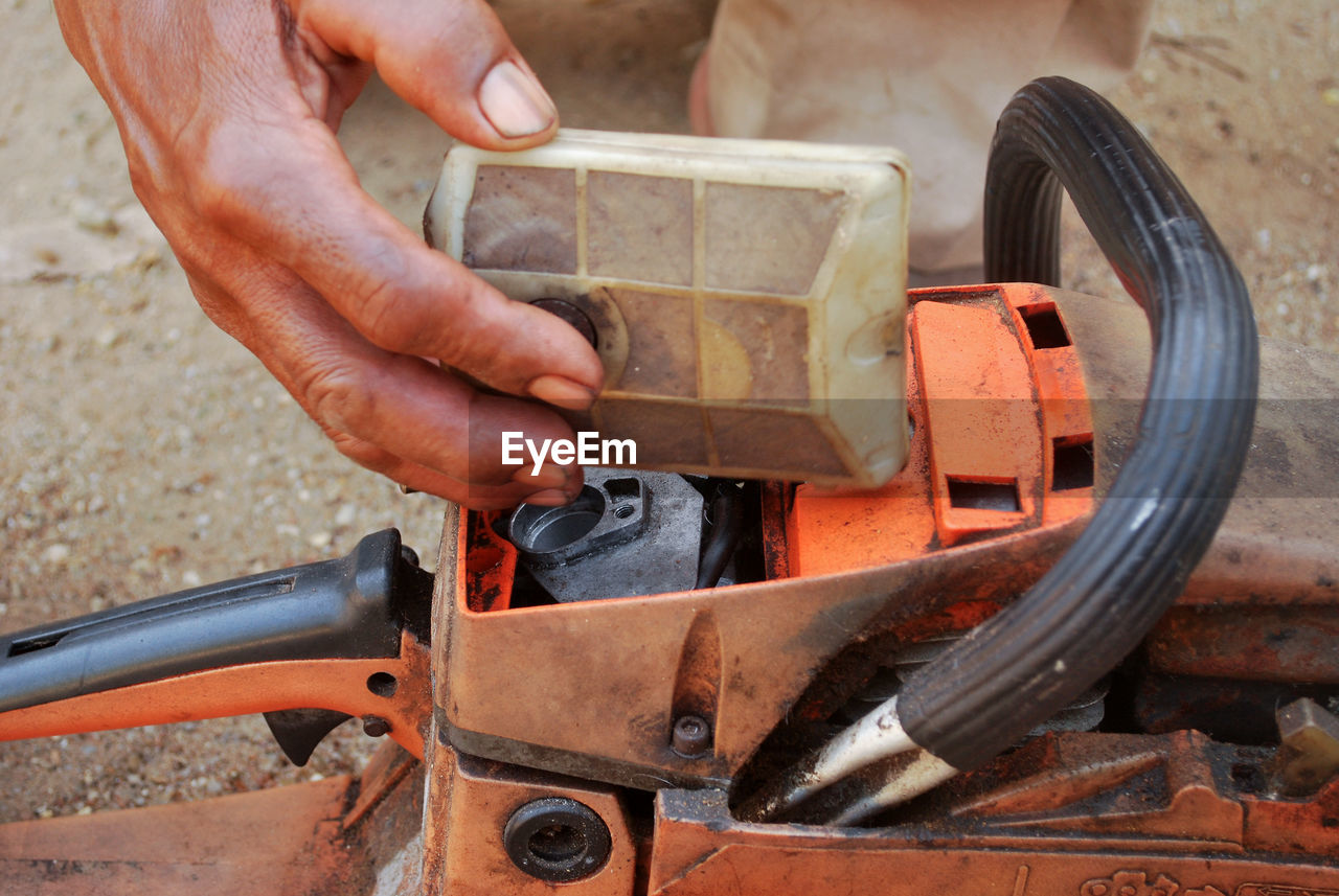 High angle view of man working on machinery