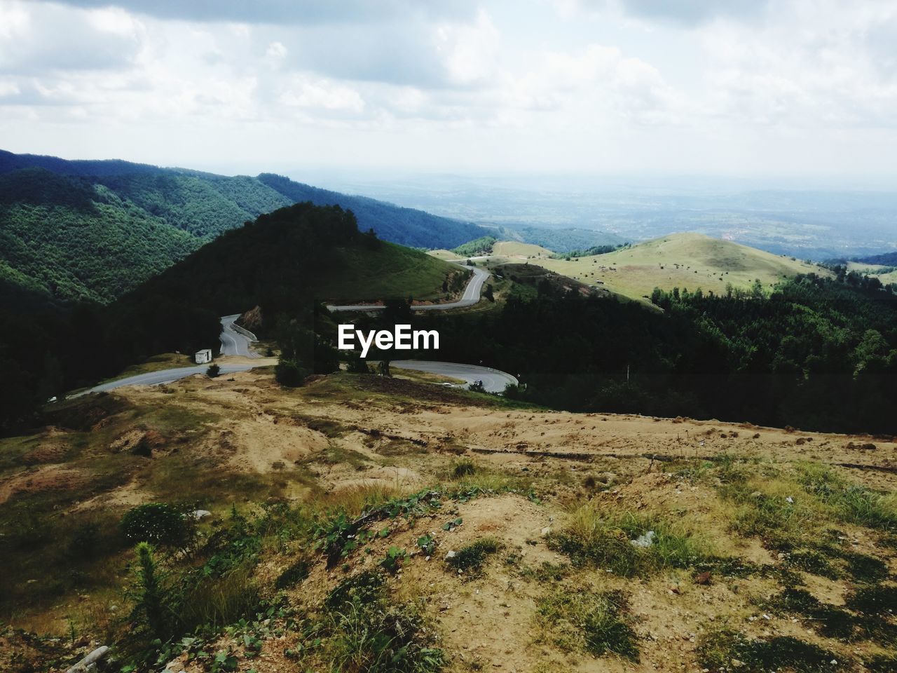 SCENIC VIEW OF GREEN LANDSCAPE AGAINST SKY