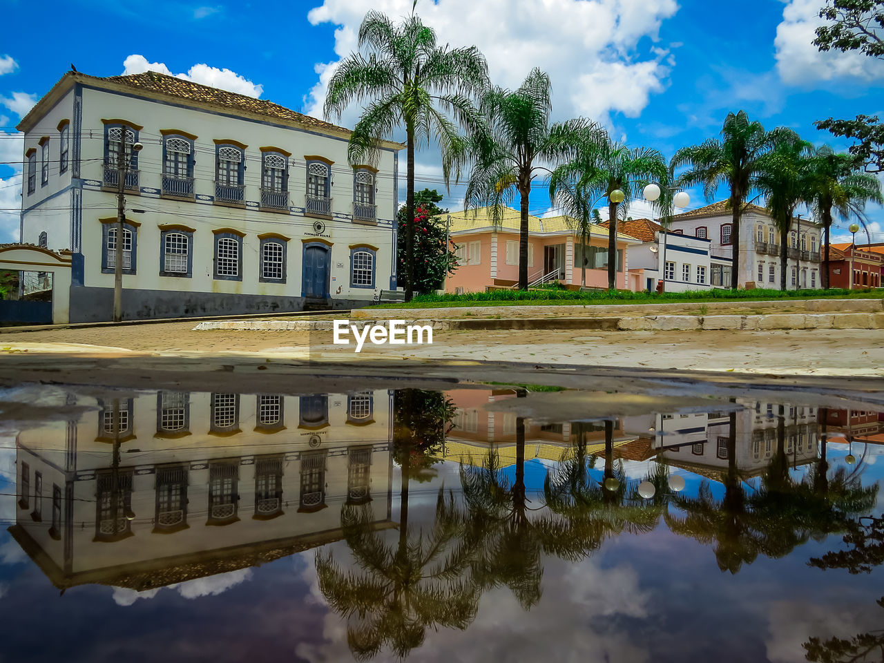 REFLECTION OF BUILDING AND WATER IN A POOL