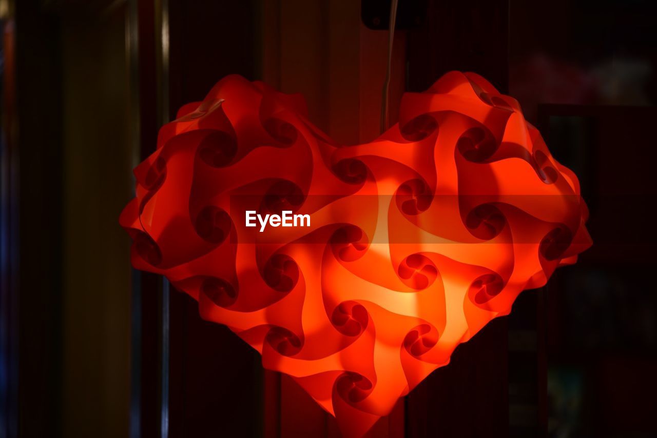 CLOSE-UP OF RED LIGHT BULB