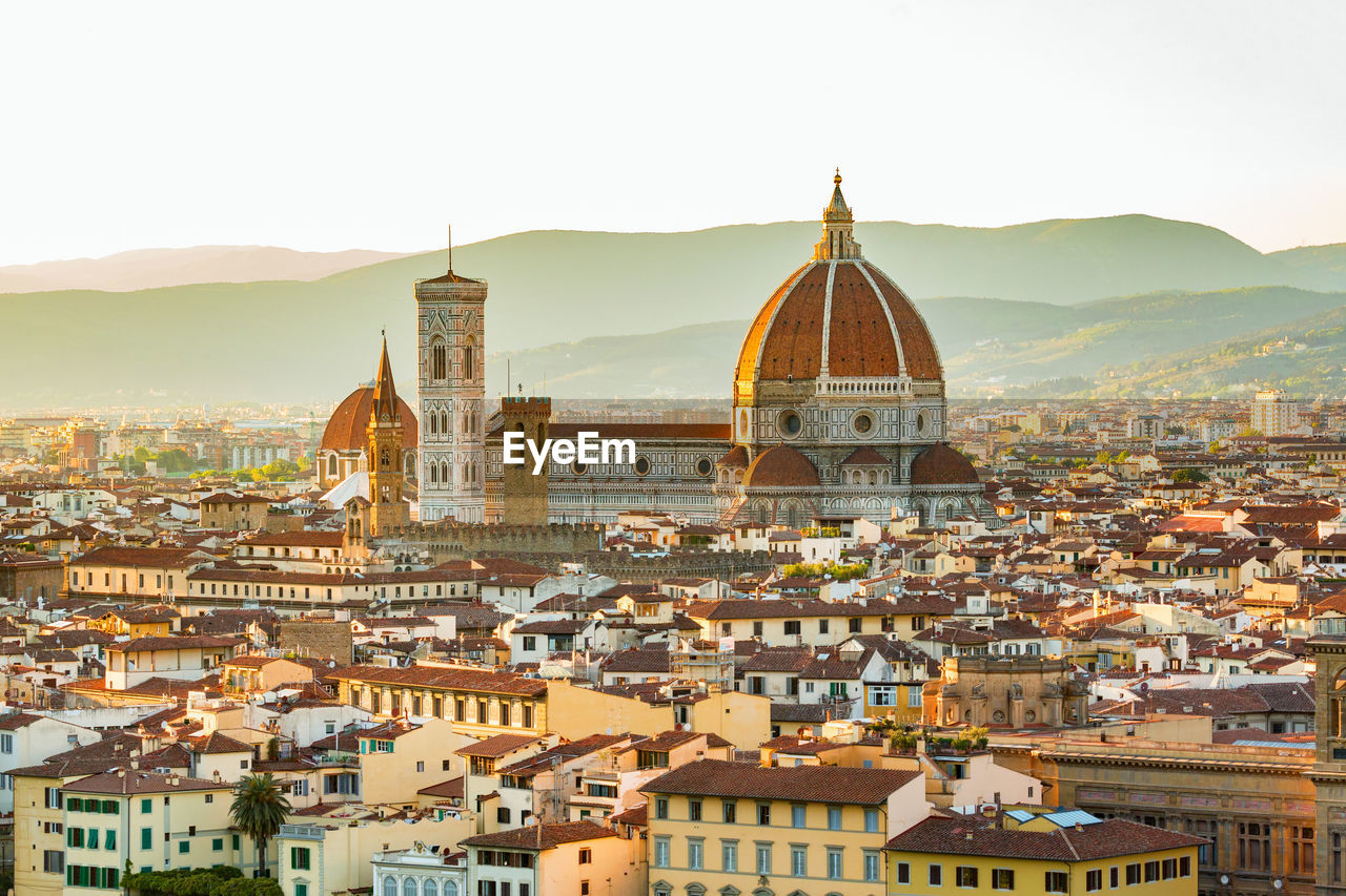 High angle view of florence cathedral in city during sunset