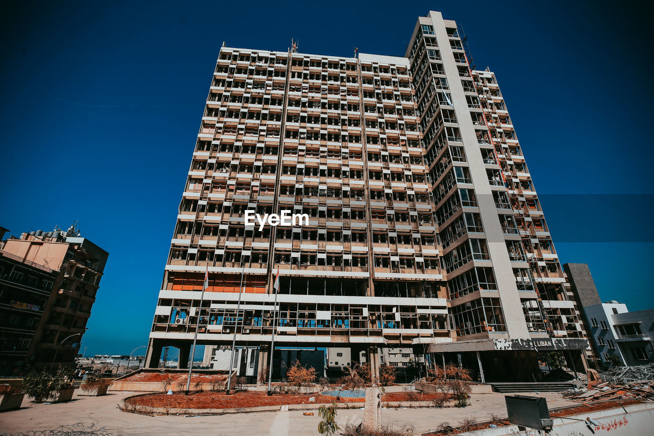 Low angle view of building against blue sky