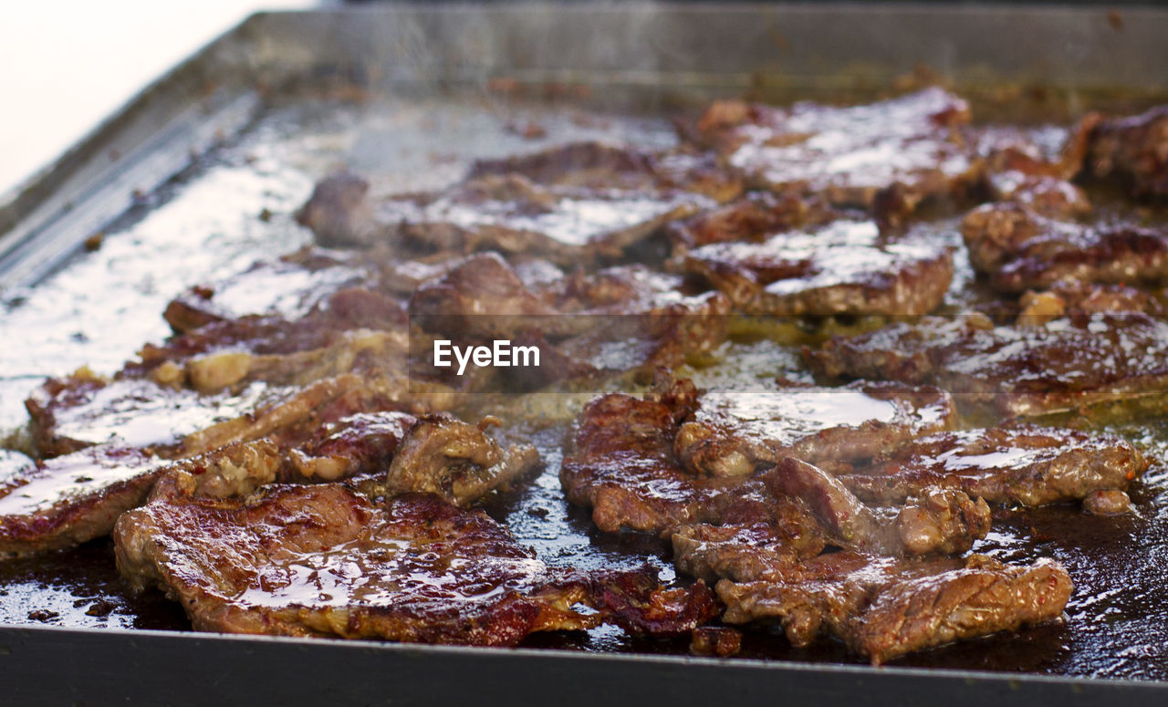 Grilling beef meat. smoke.
