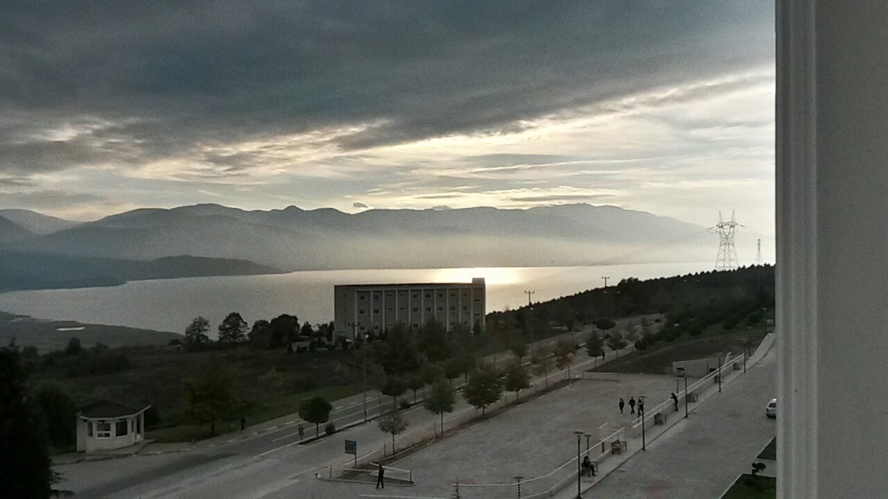 MOUNTAIN RANGE AGAINST CLOUDY SKY