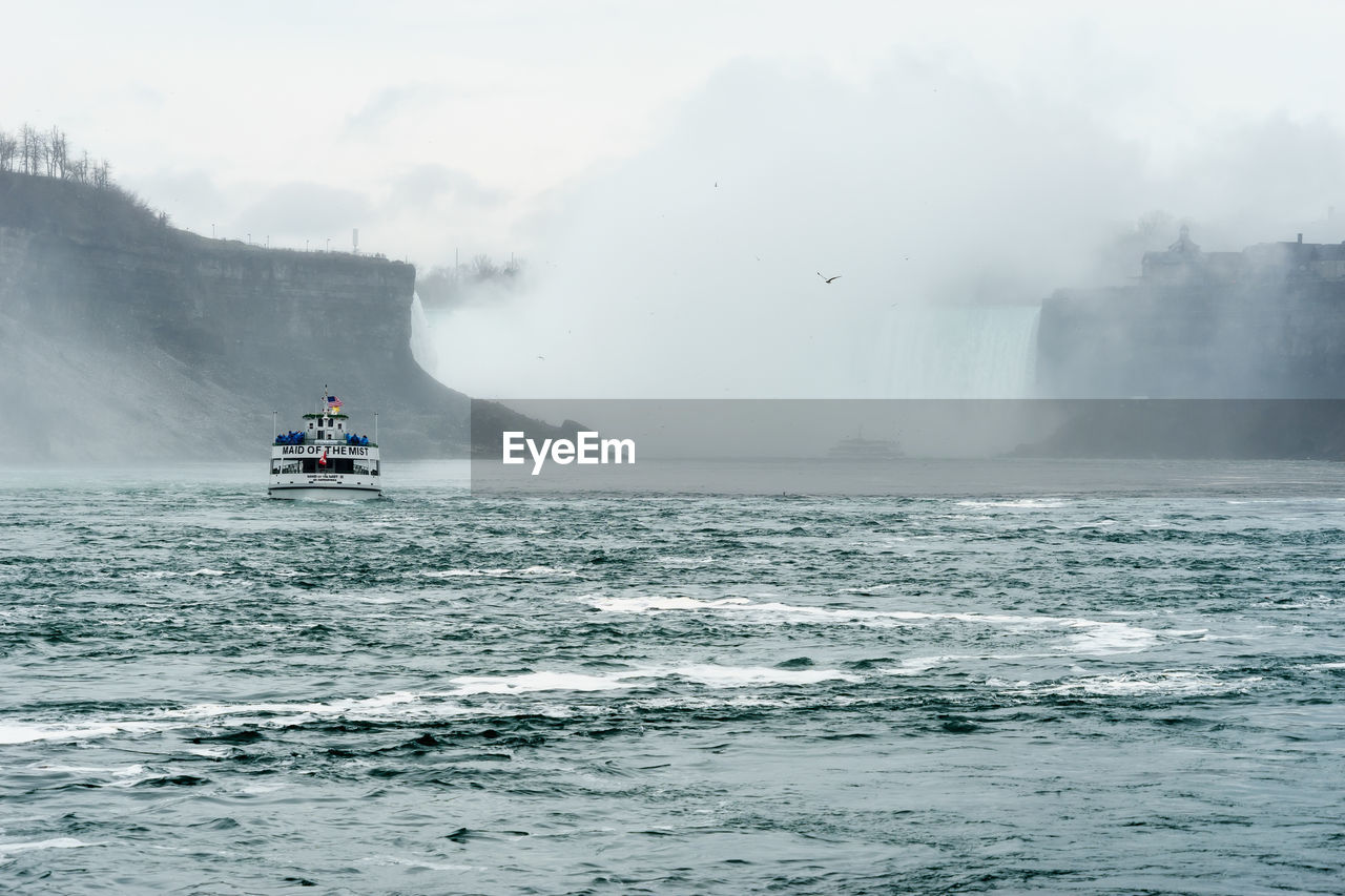 Scenic view of sea against sky during winter