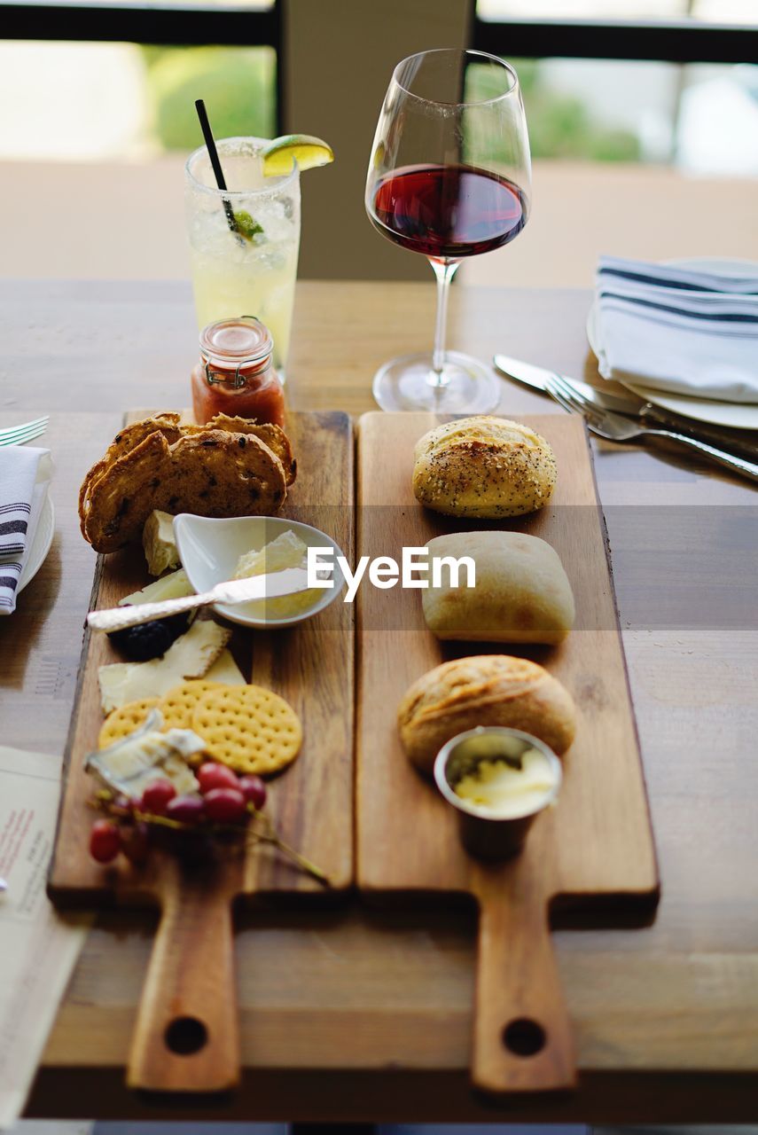 Cheese and wine served on table