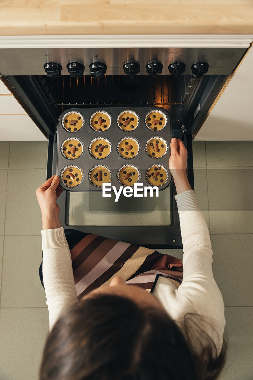 High angle view of woman preparing food at home