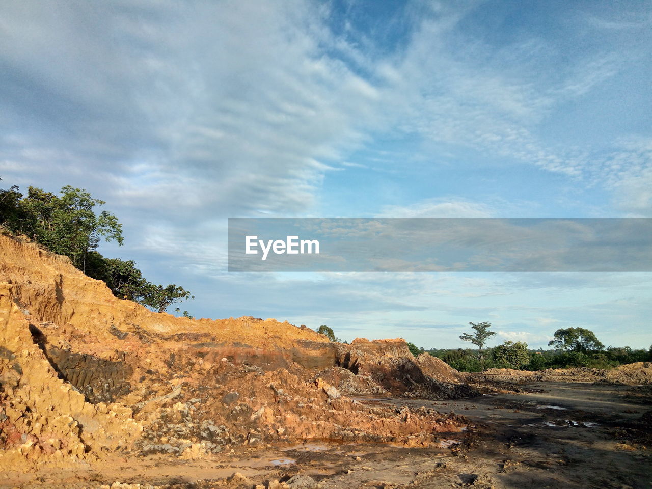 Rock formations on landscape against sky