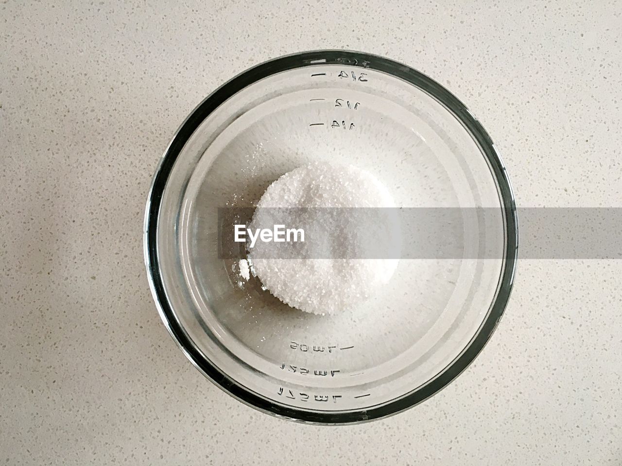 Directly above view of salt in bowl at table