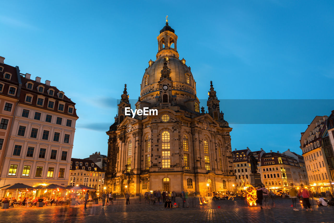 Low angle view of illuminated cathedral against sky at dusk