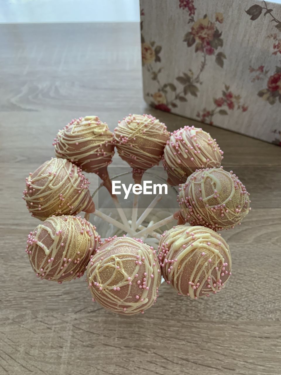 indoors, table, no people, sweet food, still life, food and drink, food, pattern, sweet, pink, high angle view, close-up, decoration, dessert, directly above, wood, icing, celebration, art, holiday, freshness, baked