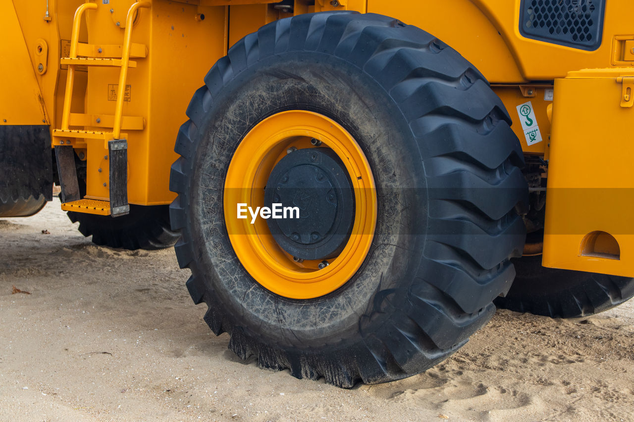 Wheel loader or bulldozer at the beach, ground moving equipment, heavy machinery 