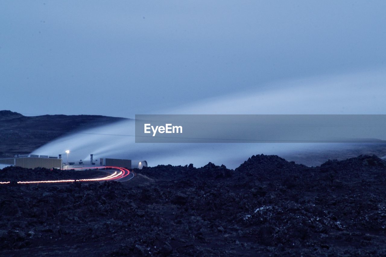 High angle view of road by sea against sky