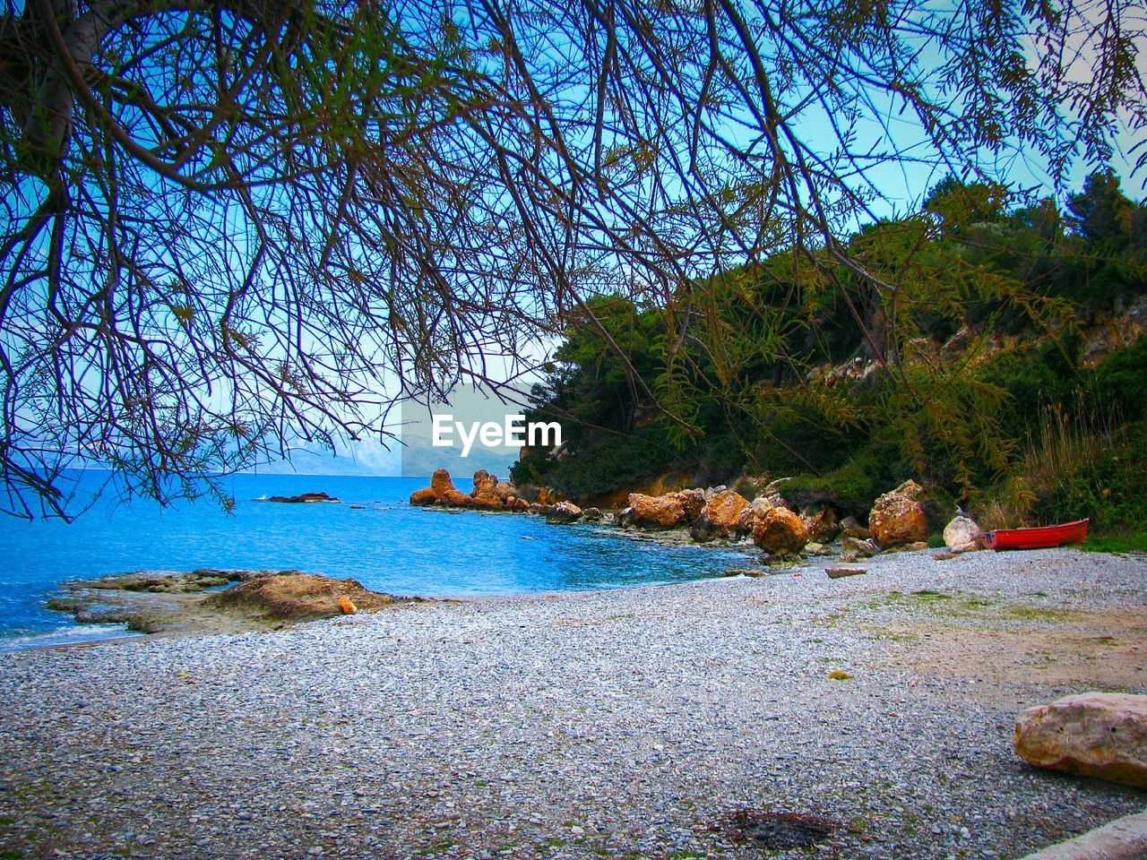 Scenic view of sea against blue sky