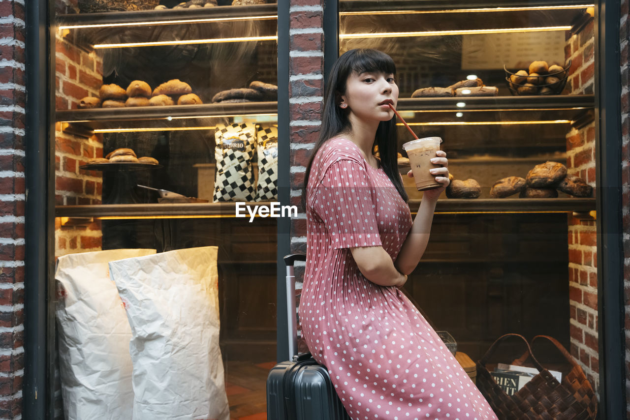 WOMAN HOLDING ICE CREAM STORE