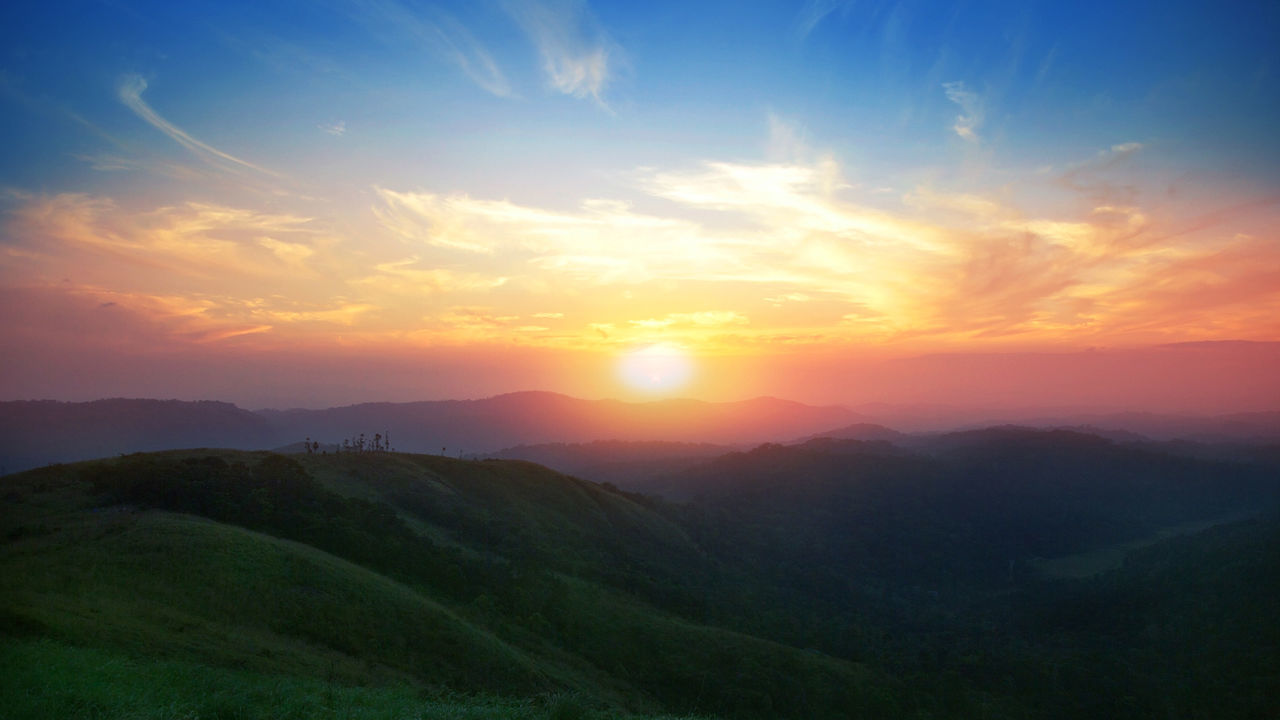 SUNSET OVER MOUNTAINS