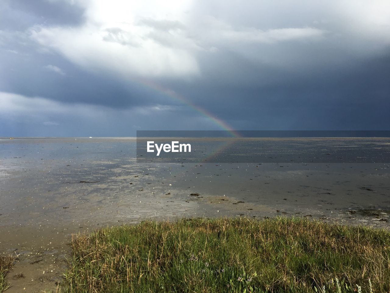 SCENIC VIEW OF SEA AGAINST RAINBOW