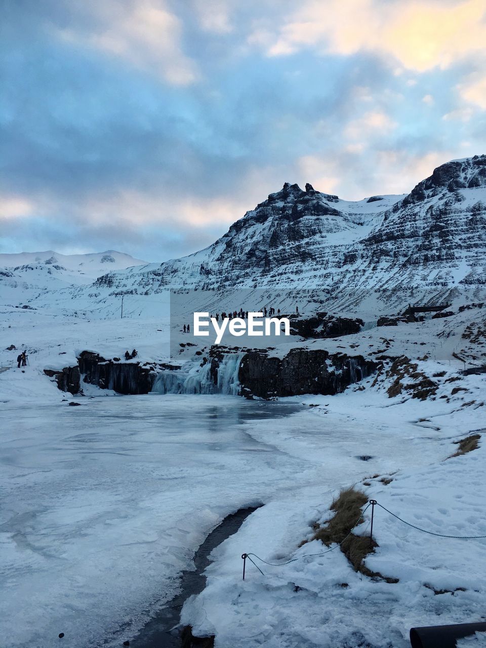 Scenic view of frozen landscape against sky