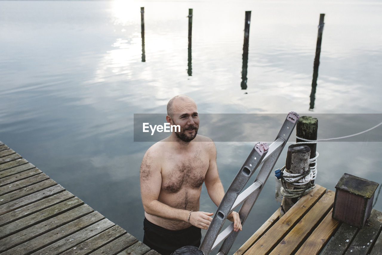 Man leaving lake