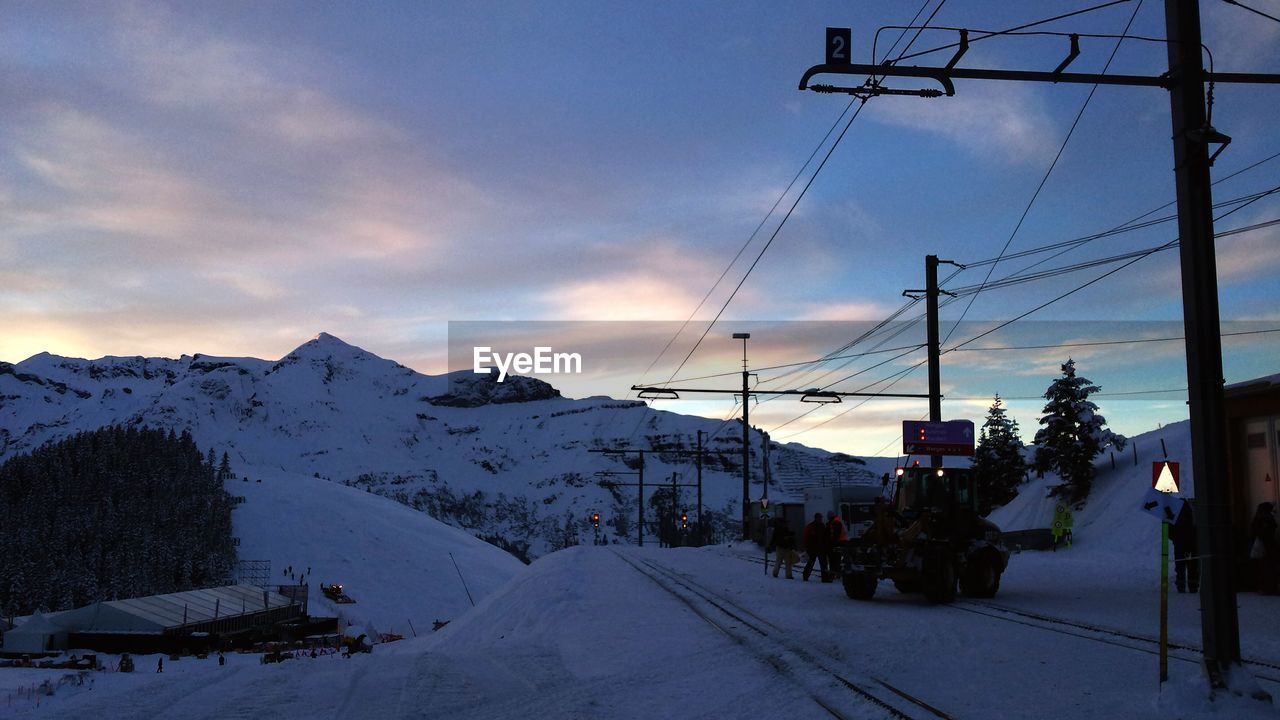 Electricity pylons on snowed landscape