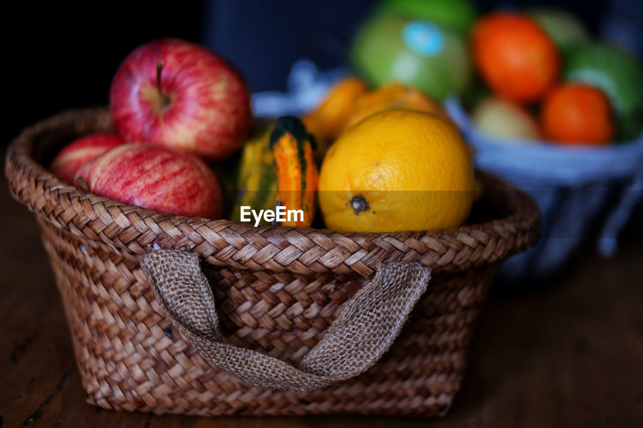 Close-up of fruits in basket on table