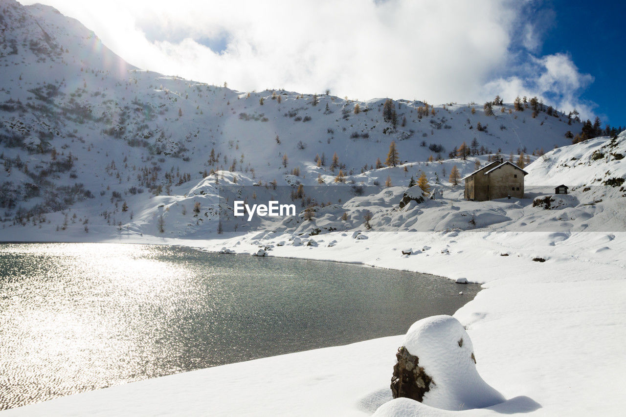 scenic view of snow covered mountain against sky