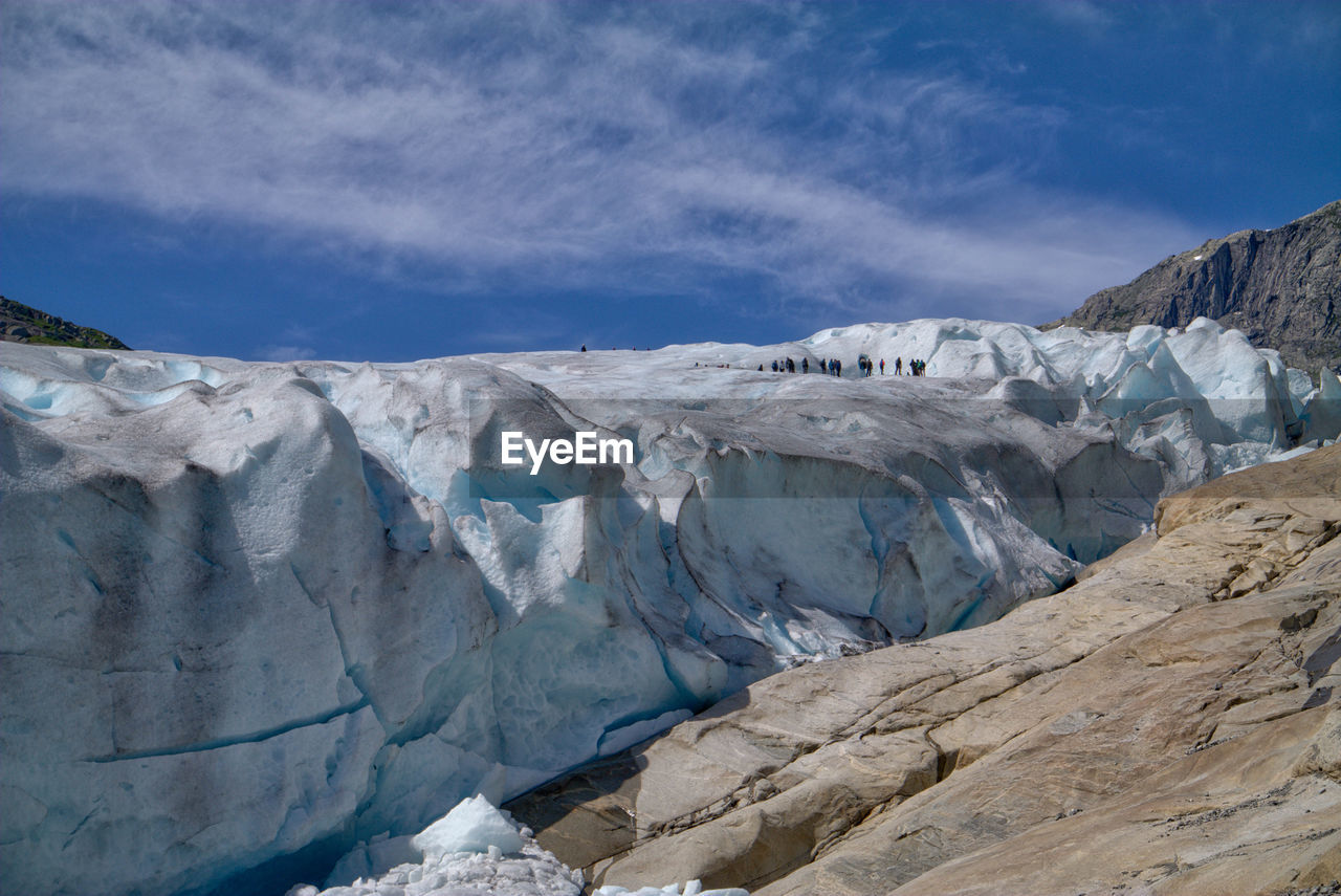 Scenic view of glacier against sky