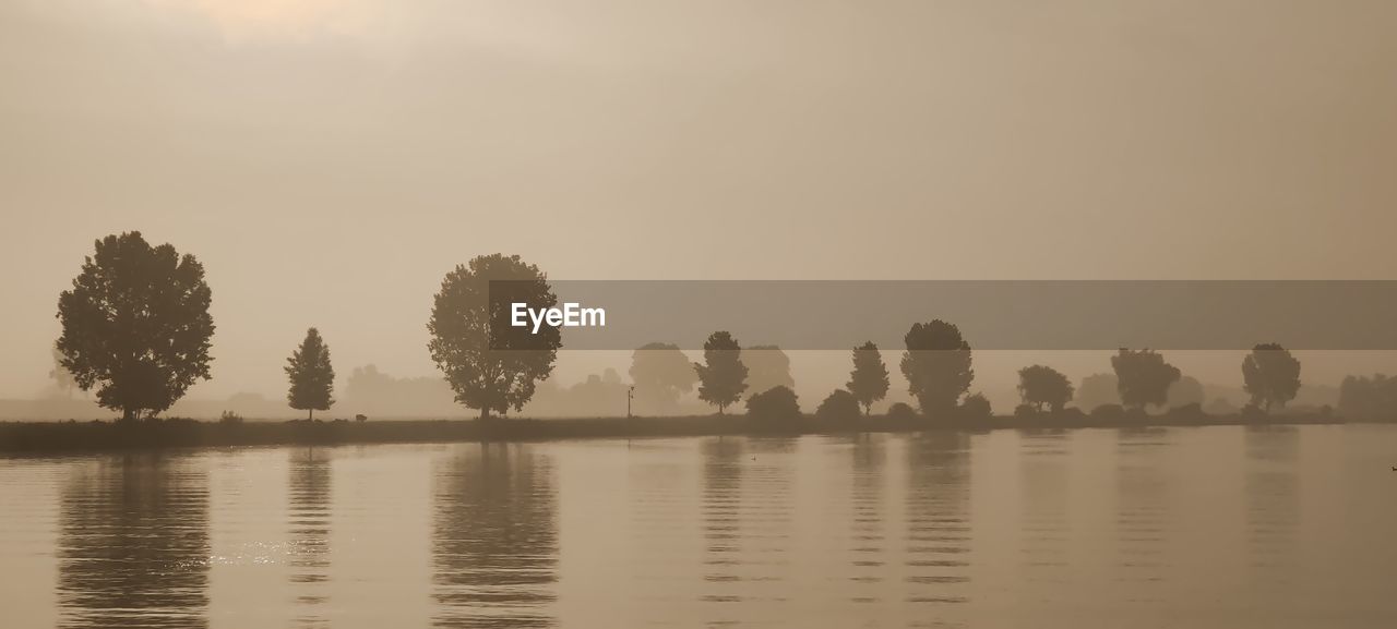 Scenic view of a river against clear sky