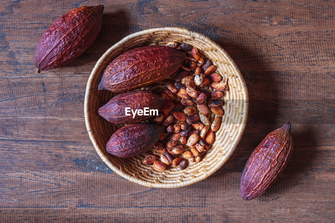 food and drink, food, healthy eating, freshness, wellbeing, wood, produce, directly above, still life, no people, high angle view, indoors, fruit, table, studio shot, plant, leaf, brown, nut - food, nut, ingredient, basket, organic, dried food, vegetable, flower, spice
