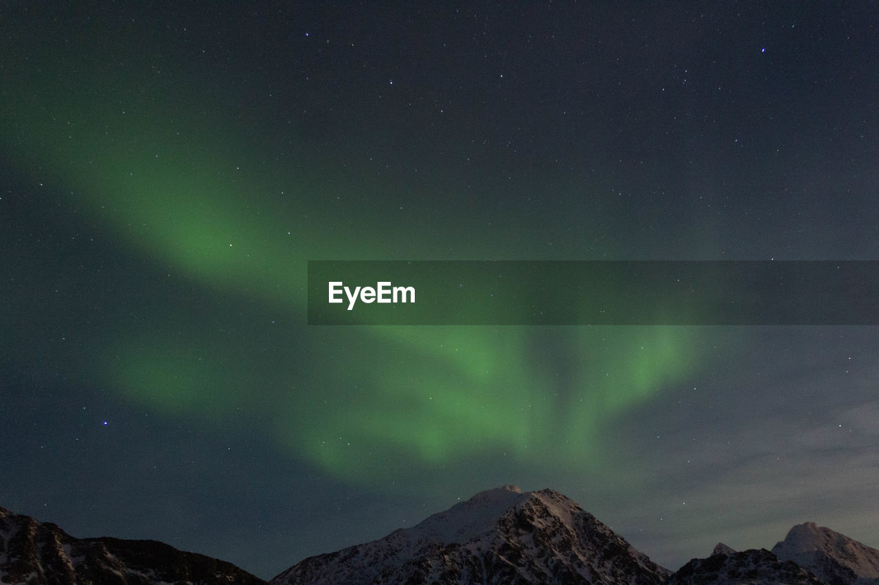 Low angle view of mountain against sky at night
