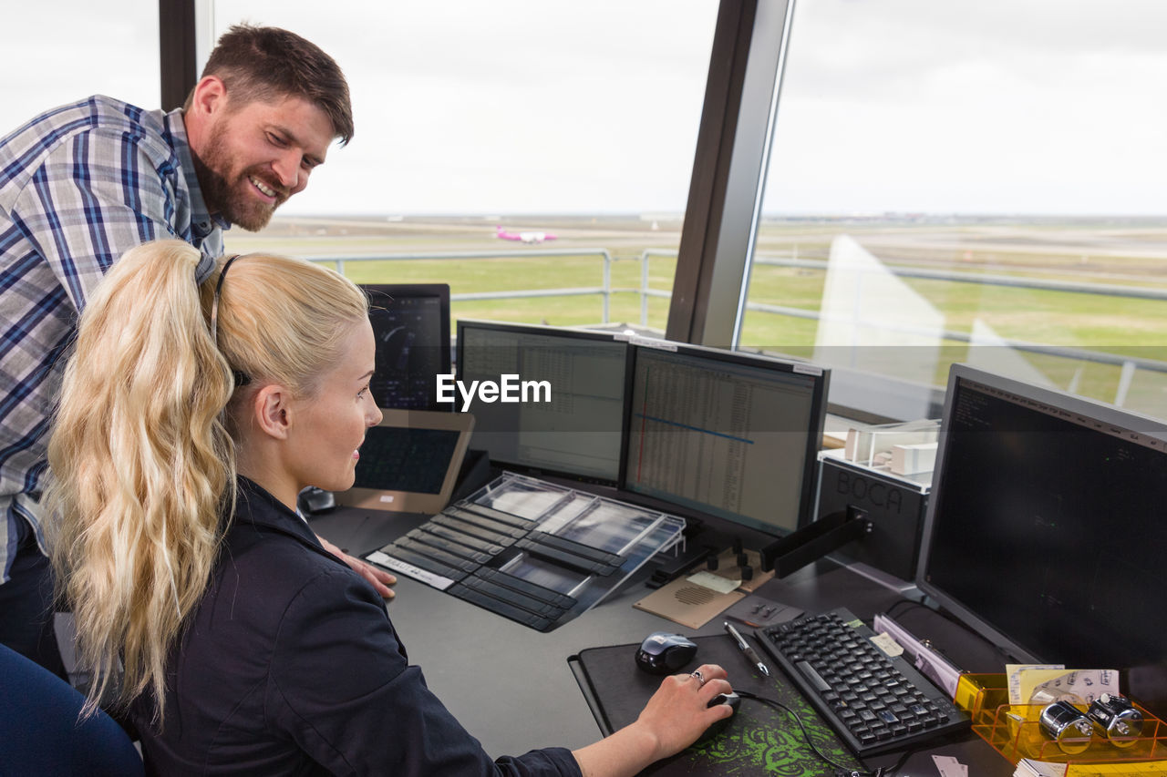 Male and female dispatchers working together