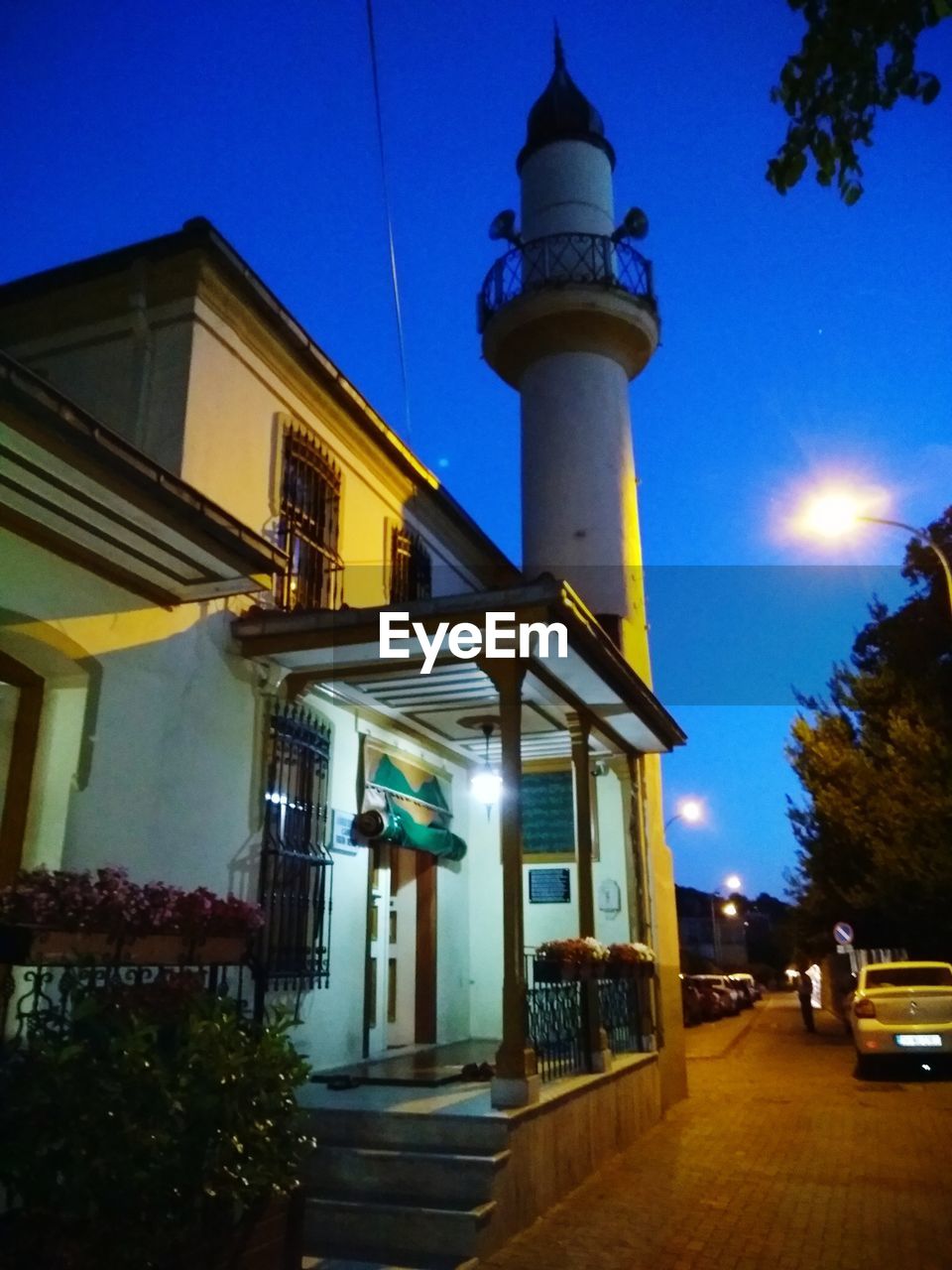 LOW ANGLE VIEW OF ILLUMINATED BUILDING