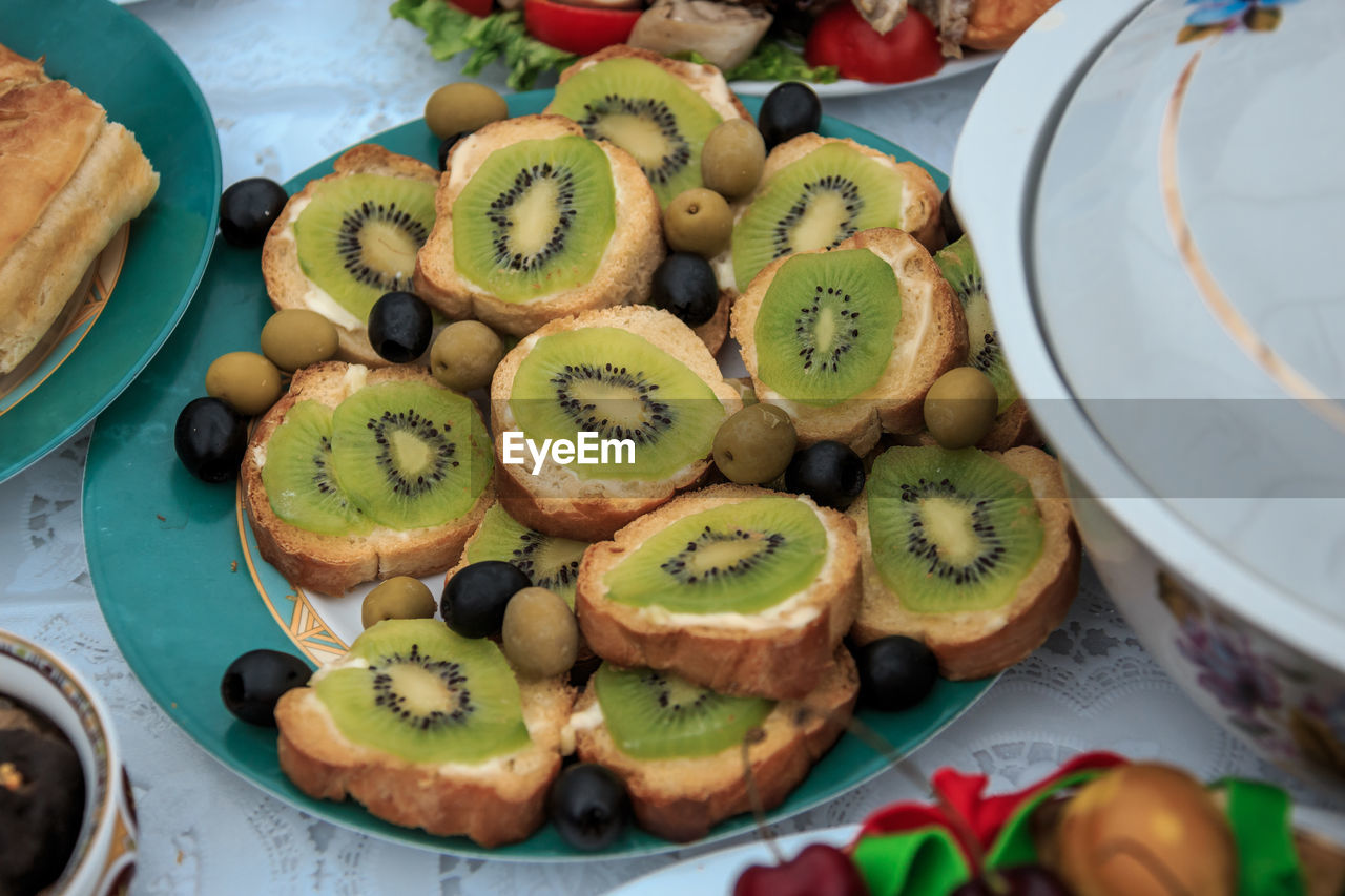 High angle view of kiwi sandwich in plate on table