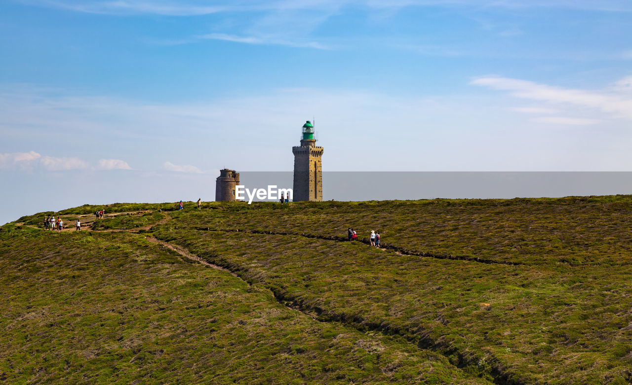 LIGHTHOUSE ON FIELD OF BUILDING