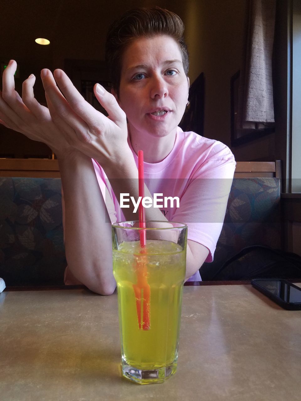 Close-up of woman sitting at restaurant