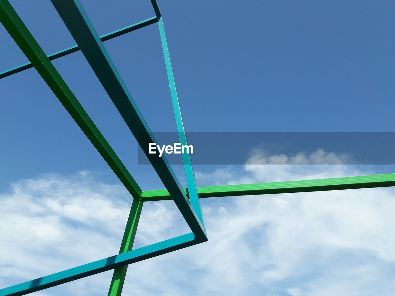 Low angle view of metallic structure against sky