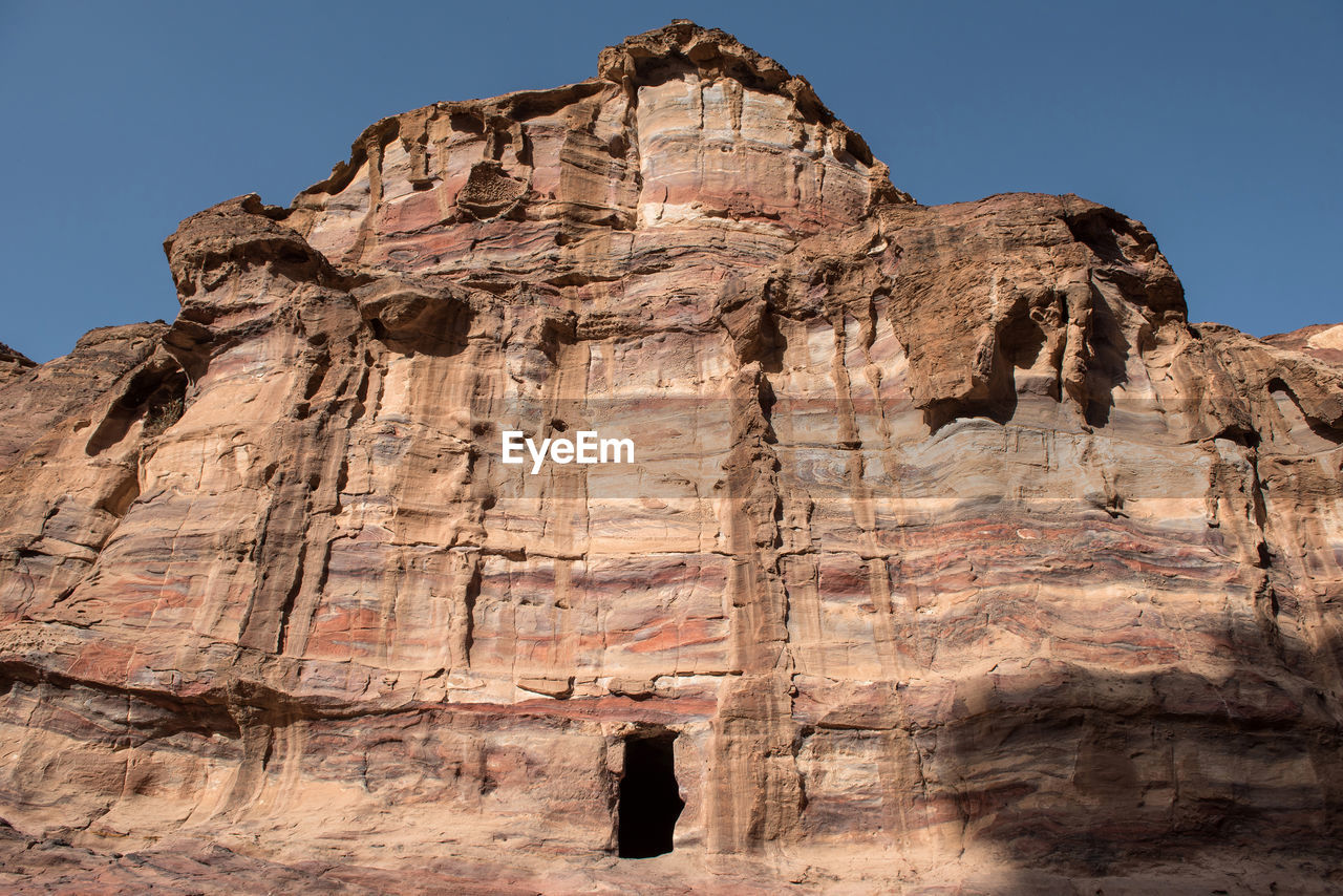 Low angle view of cave in rock formation at petra