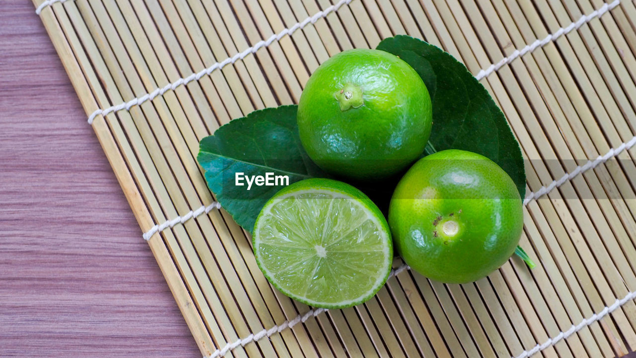 High angle view of green fruits in basket